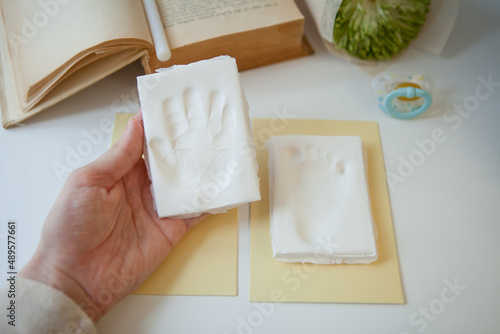 Baby footprint and handprint clay mold To remember in the future how small the baby was in childhood