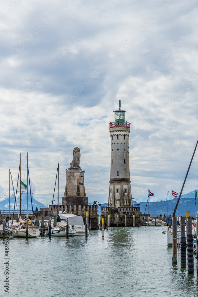 Lindau, Germany. Lighthouse and figure of a lion (19th century) at the entrance to the harbor