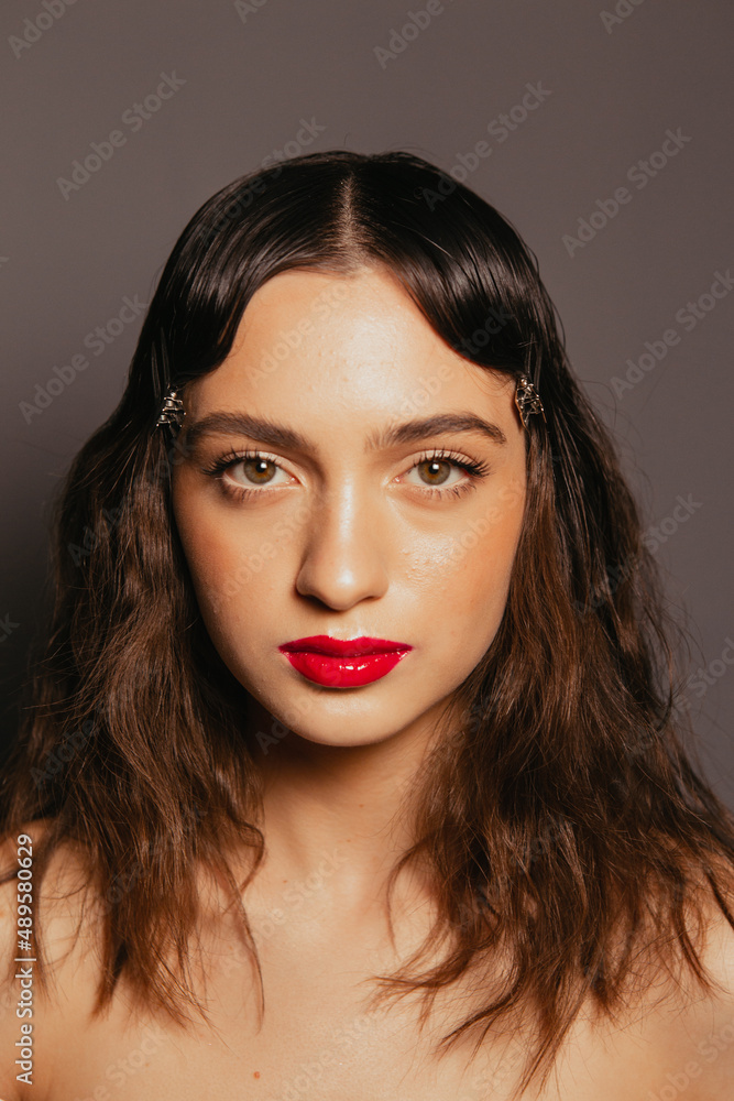 Portraits of a beautiful girl with makeup and red lips Portraits of a beautiful girl with makeup and red lips