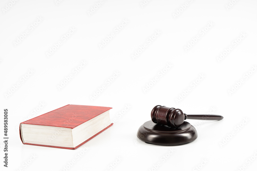 Law concept - law book with a wooden judge's gavel on table. Copy space for text Law concept - law book with a wooden judge's gavel on table. Copy space for text