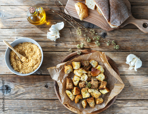 Croutons and bread crumbs with spices made with stale bread. Zero waste concept for cooking photo