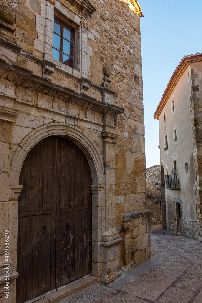 Culla, Castellon province, Spain. Historic medieval street and wooden door in the village of Culla, one of Spain's most beautiful villages.