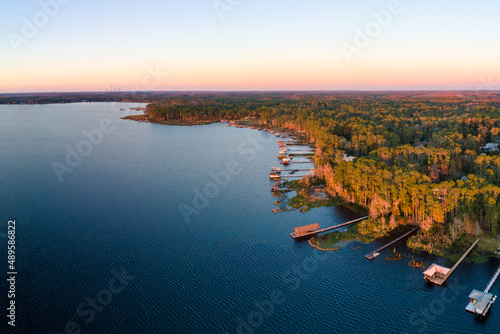 Panoramic aerial photograph of Lake Mary Jane, Orlando Florida.  In the  distance is the Stanton energy center. photo