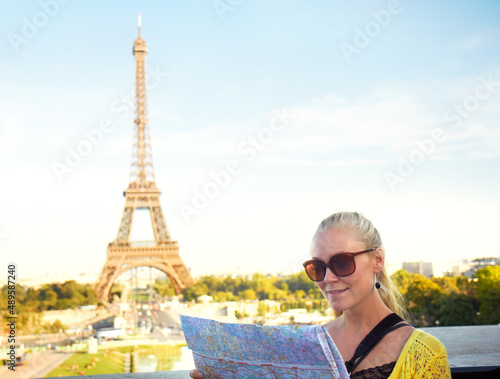 This map is very accurate. A pretty young woman holding a map while sight seeing in the Paris. © Stigur/peopleimages.com