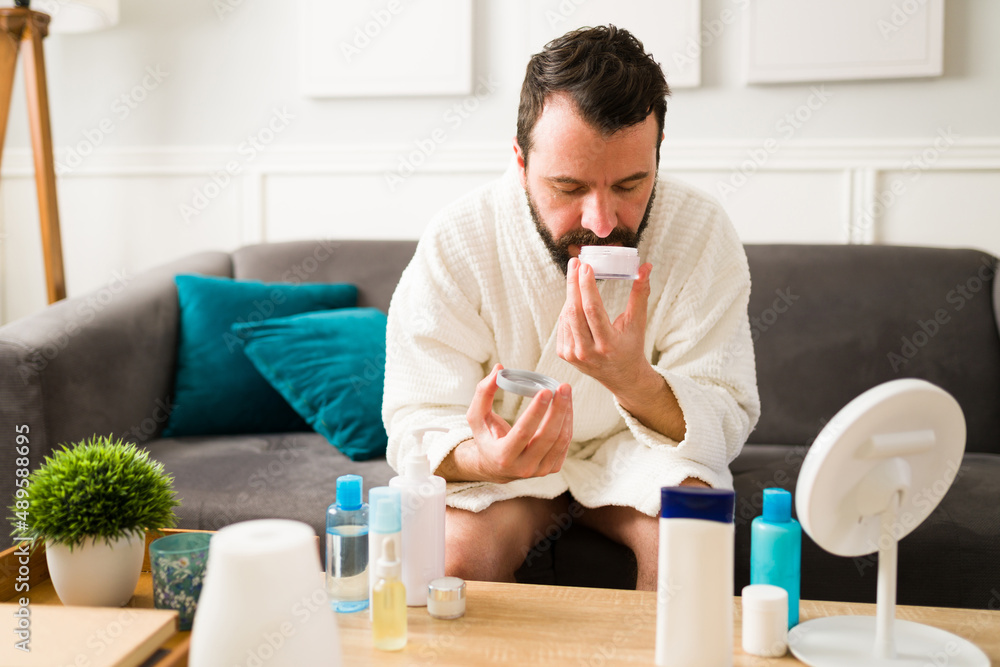 Adult man following his skin care routine Adult man following his skin care routine
