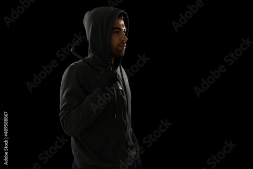 Side view of a burglar with a crowbar
