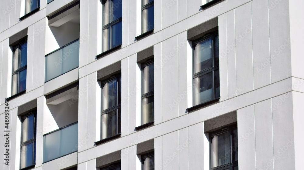 Fragment of modern residential apartment with flat buildings exterior. Detail of new luxury house and home complex. Fragment of modern residential apartment with flat buildings exterior. Detail of new luxury house and home complex.