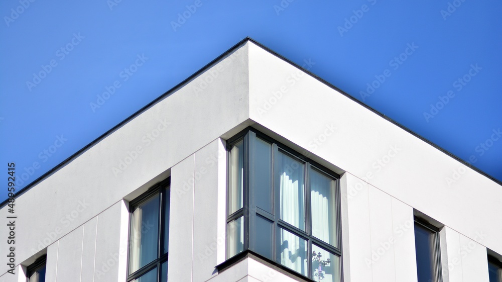 Fragment of modern residential apartment with flat buildings exterior. Detail of new luxury house and home complex.  