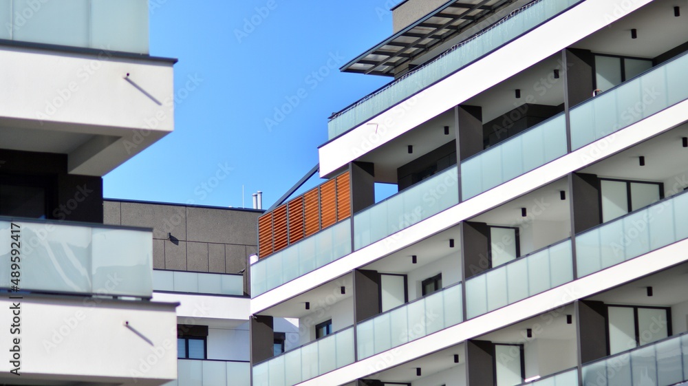 Fragment of modern residential apartment with flat buildings exterior. Detail of new luxury house and home complex. Fragment of modern residential apartment with flat buildings exterior. Detail of new luxury house and home complex.