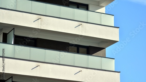Fragment of modern residential apartment with flat buildings exterior. Detail of new luxury house and home complex. 