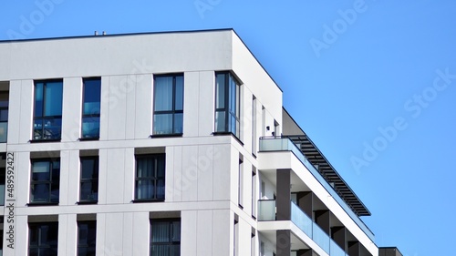 Fragment of modern residential apartment with flat buildings exterior. Detail of new luxury house and home complex. 