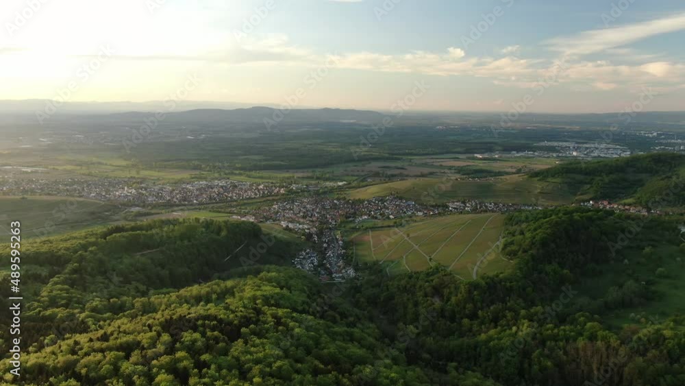 Aerial view flying over rural northern european town in foothills of Alps Aerial view flying over rural northern european town in foothills of Alps