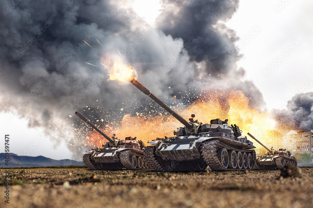 Group of main battle tanks with a city on fire on the background. One tank firing a shell from the barrel. Military or army special operation
