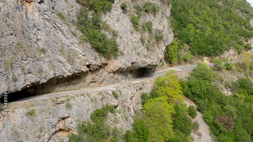 Aerial shot of canyon and road tunnel near the city of Sparta, Greece. Europe. Drone shot of a huge canyon. Landscape of Green canyon. Aerial View 4K. Amazing nature Aerial shot of canyon and road tunnel near the city of Sparta, Greece. Europe. Drone shot of a huge canyon. Landscape of Green canyon. Aerial View 4K. Amazing nature