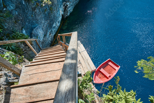 Stairs and boat on a Lake photo