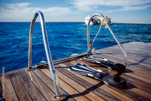 Bilde på lerret Diving with scuba gear and flippers in sea, snorkeling tour on boat yacht