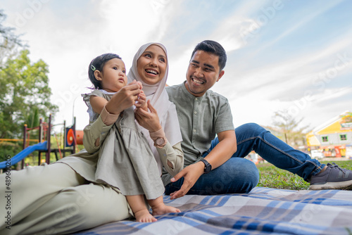 Happy Muslim Family Have A Picnic Outdoor  photo