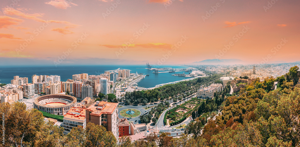 Malaga, Spain. Panorama Cityscape Elevated View Of Malaga In Sunny Summer Evening. Altered Sunset Sky.