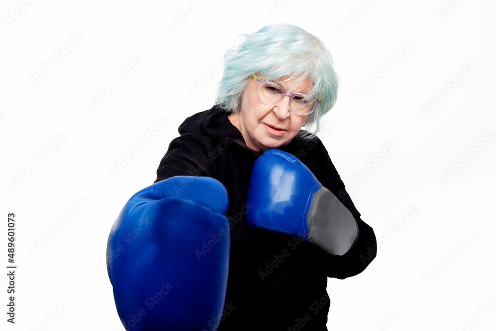 older woman with boxing gloves and guard pose older woman with boxing gloves and guard pose