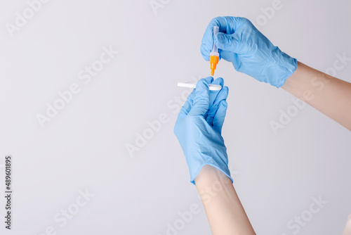 Wallpaper Mural Medic hands in gloves holding COVID-19 test, rapid test kit for diagnosis Coronavirus infection Torontodigital.ca