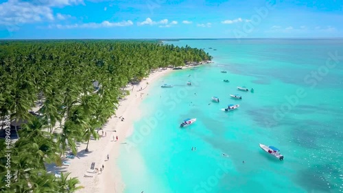 Aerial view of Saona Island in Dominican Republuc. Caribbean Sea with clear blue water and green palms. Tropical beach. The best beach in the world. photo