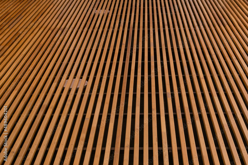 Fototapeta premium Installation of wooden moldings on the ceiling of a building or house's first floor parking lot