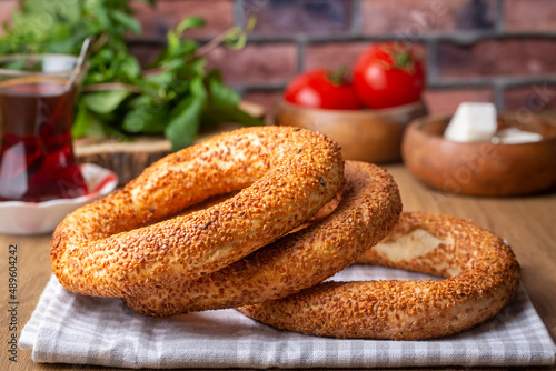 Turkish fast food bagel called Simit. Turkish bagel Simit with sesame. Bagel is traditional Turkish bakery food. Turkish name; simit - gevrek photo