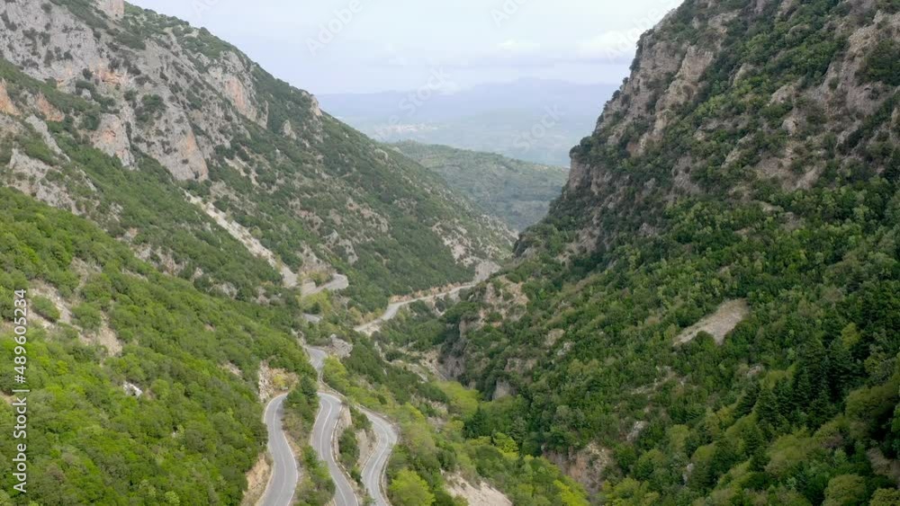 Aerial shot of canyon and road tunnel near the city of Sparta, Greece. Europe. Drone shot of a huge canyon. Landscape of Green canyon. Aerial View 4K. Amazing nature Aerial shot of canyon and road tunnel near the city of Sparta, Greece. Europe. Drone shot of a huge canyon. Landscape of Green canyon. Aerial View 4K. Amazing nature
