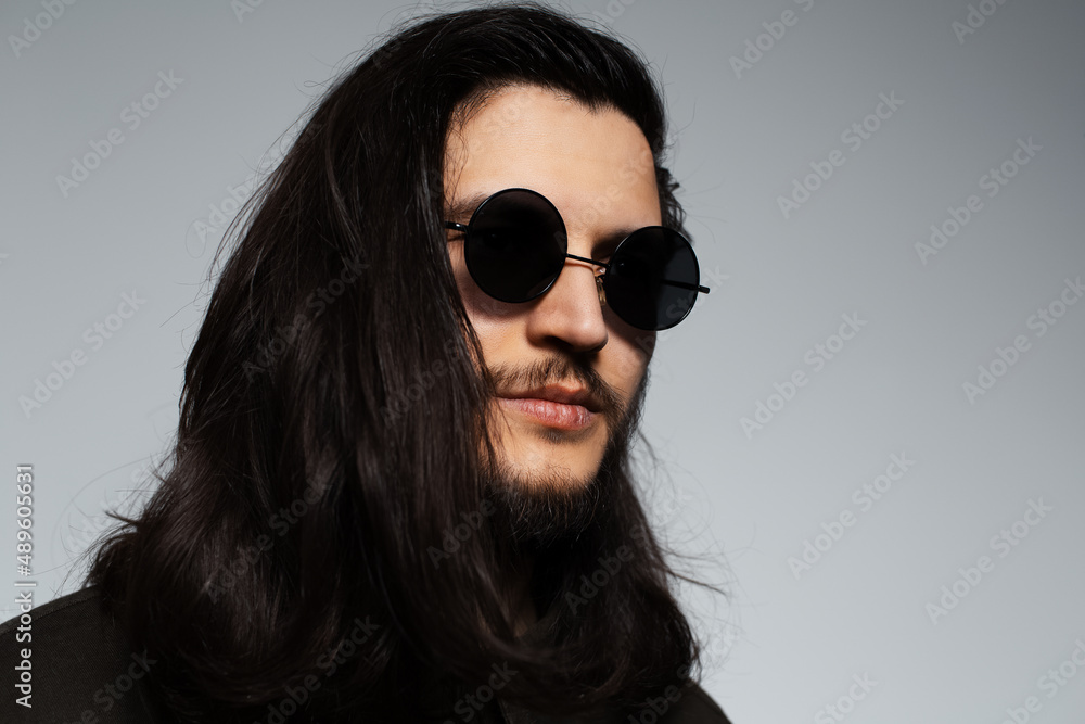 custom made wallpaper toronto digitalStudio portrait of young attractive guy, with long hair and shades.