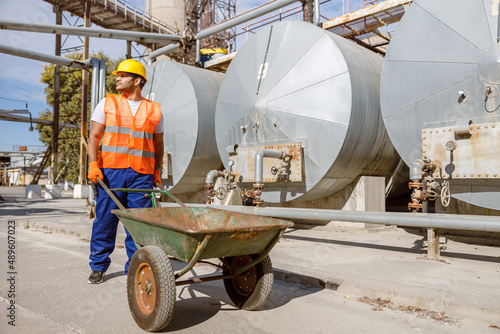 Experienced worker concentrating at his work in plant