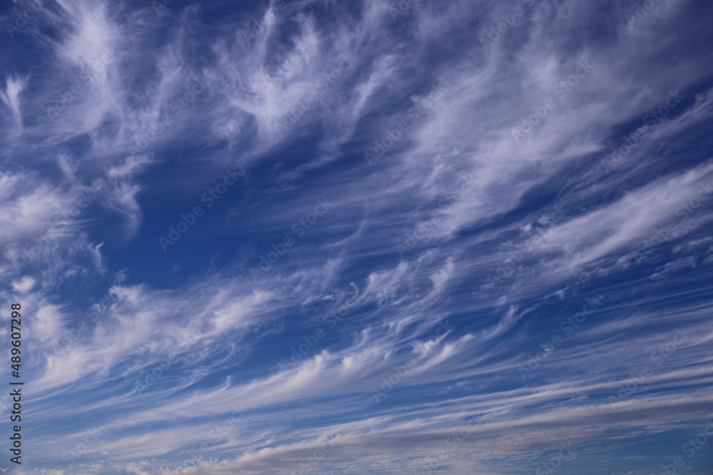 Blue sky with light white cirrus clouds