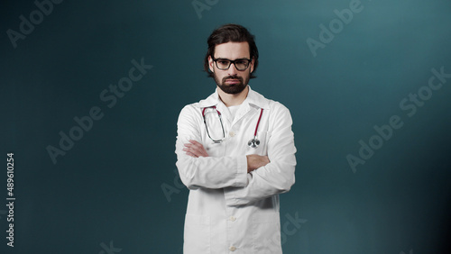 The doctor straighten his glasses, showing confidence and calmness
