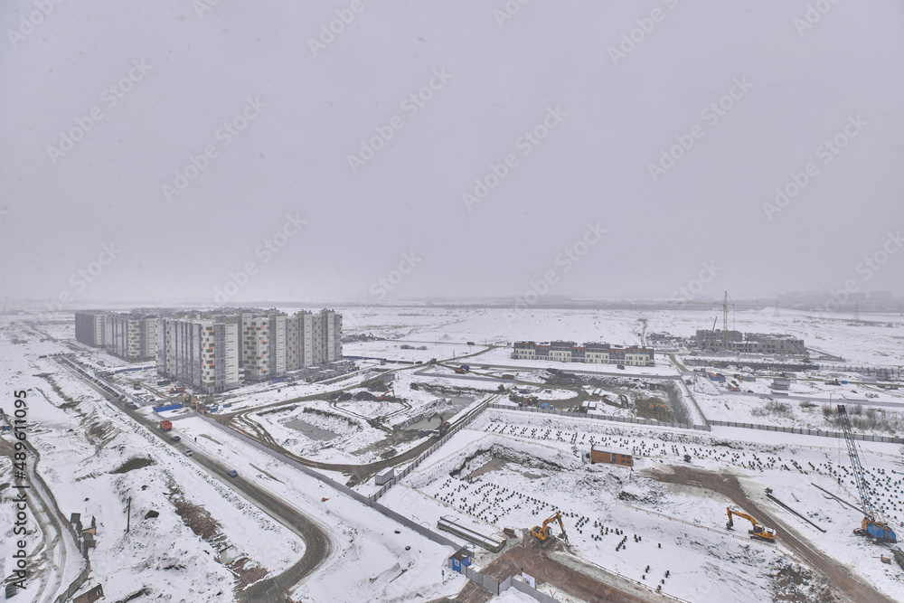 View from the window at the construction site in winter 