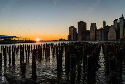 Panoramic view of Manhattan skyline and colorful sky during a beautiful sunset in New York City , NY