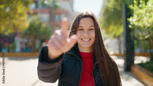 Wallpaper Mural Young woman smiling confident with welcome expression at park Torontodigital.ca