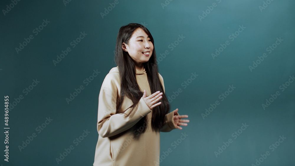 A young asian lady is dancing delightfully in slow motion A young asian lady is dancing delightfully in slow motion