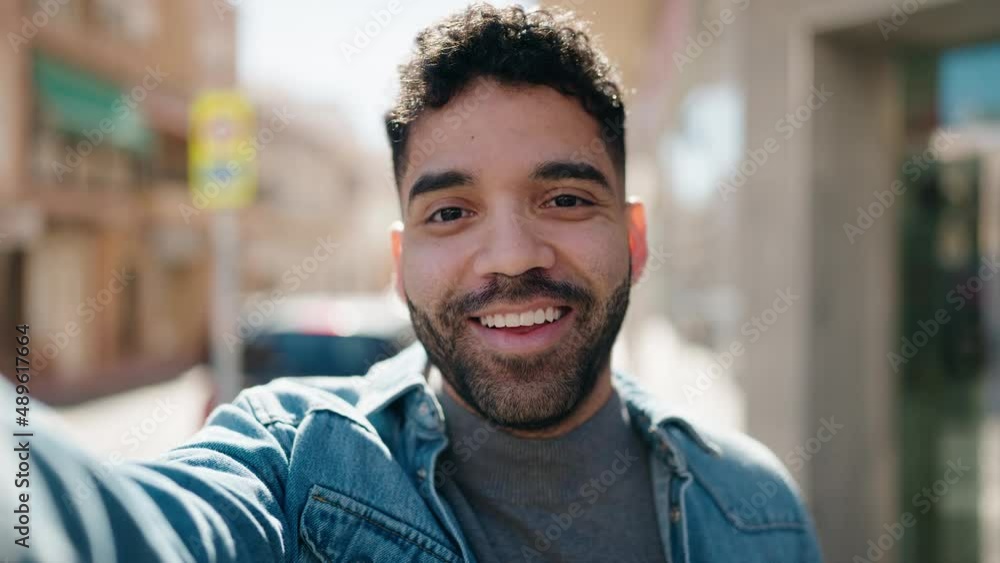 Young arab man smiling confident having video call at street Young arab man smiling confident having video call at street