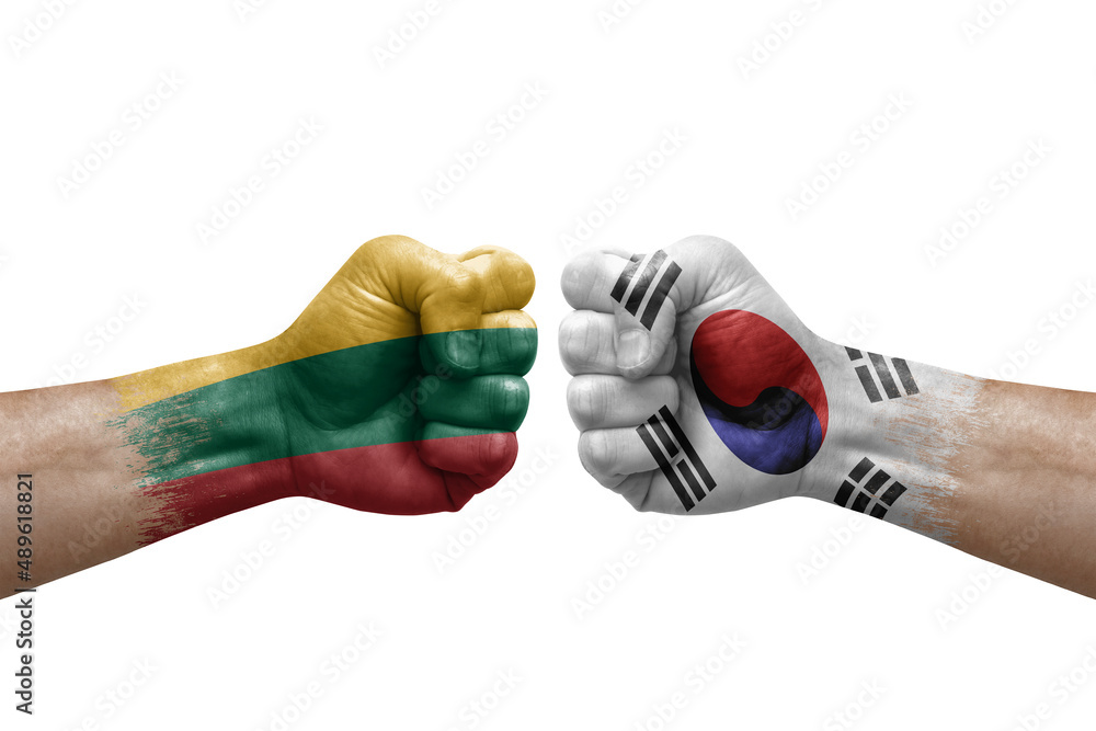 Two hands punch to each others on white background. Country flags painted fists, conflict crisis concept between lithuania and south korea Two hands punch to each others on white background. Country flags painted fists, conflict crisis concept between lithuania and south korea