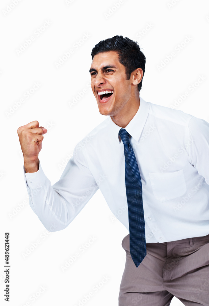 Victorious young business man. Portrait of happy young business man celebrating victory on white background.