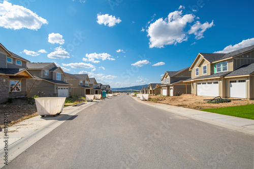 A street of new construction homes being built in a residential suburban development in Spokane, Washington, USA.