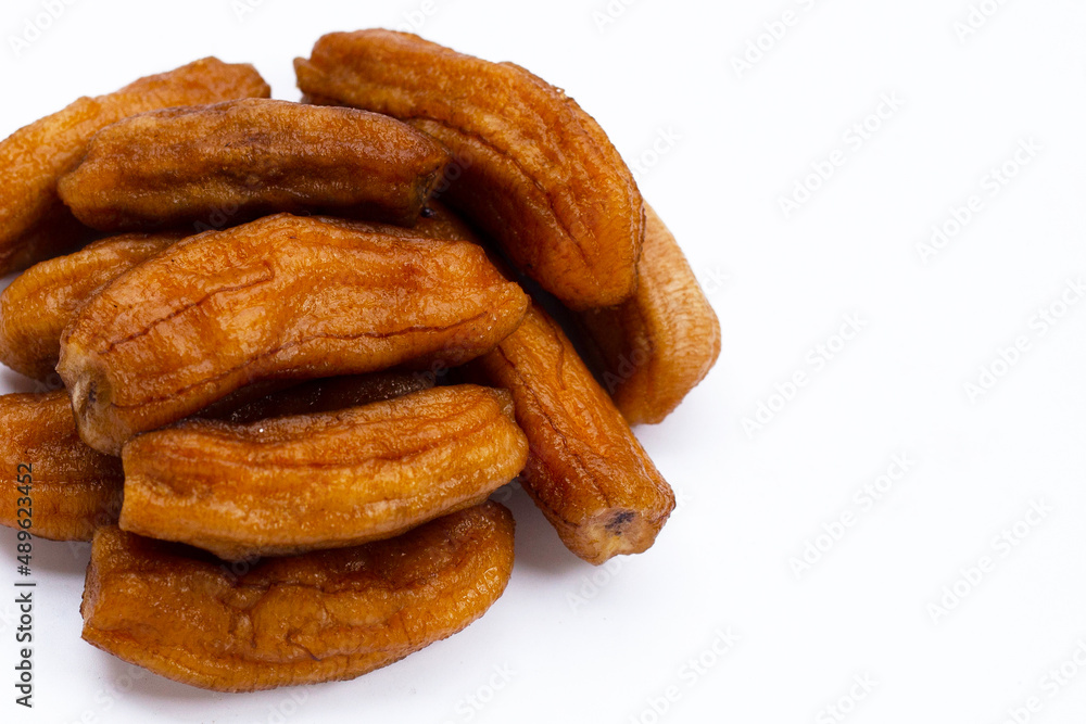 Sun-dried bananas on white background. Sun-dried bananas on white background.