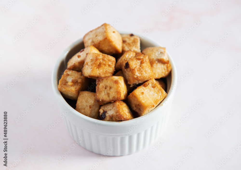 Baked Tofu with spices in a ramekin 