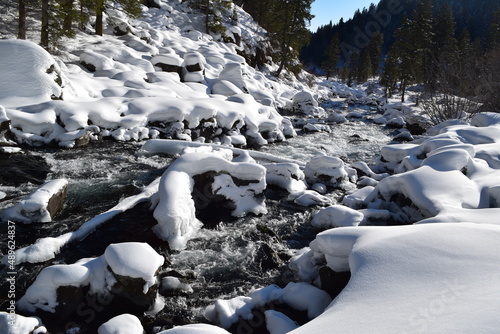 River running through snow-covered rocks