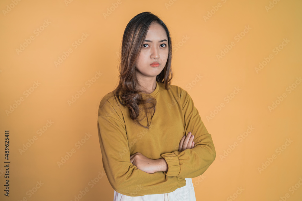 young woman stand cross hand with unhappy sad face