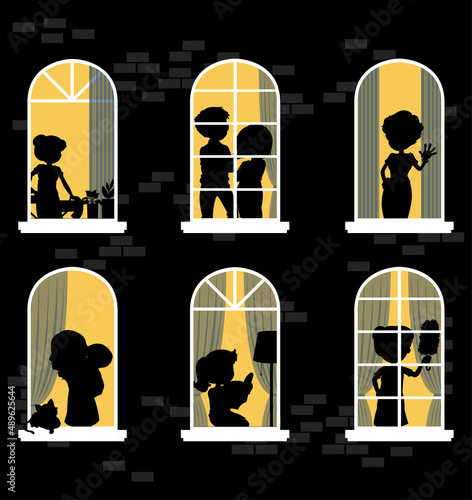 Night windows building with people silhouettes