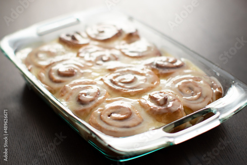 clear pan of glazed homemade cinnamon rolls