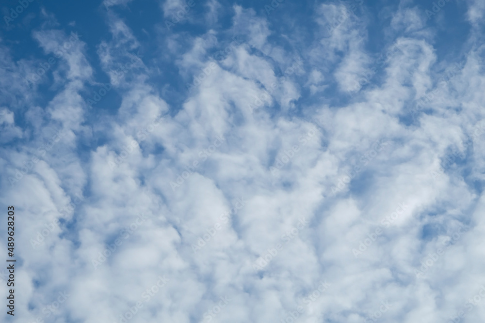 On a bright sunny afternoon sky. Altocumulus Clouds. Great for background, wallpaper or as backdrop. On a bright sunny afternoon sky. Altocumulus Clouds. Great for background, wallpaper or as backdrop.