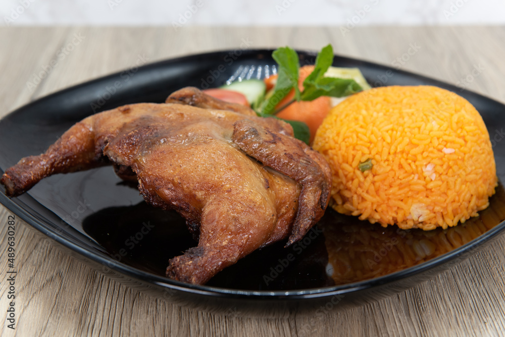 Crispy rotisserie chicken served with rice for a delicious Vietnamese meal Crispy rotisserie chicken served with rice for a delicious Vietnamese meal