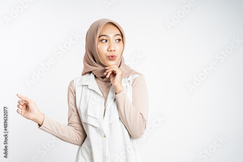asian muslim woman expression while standing over white