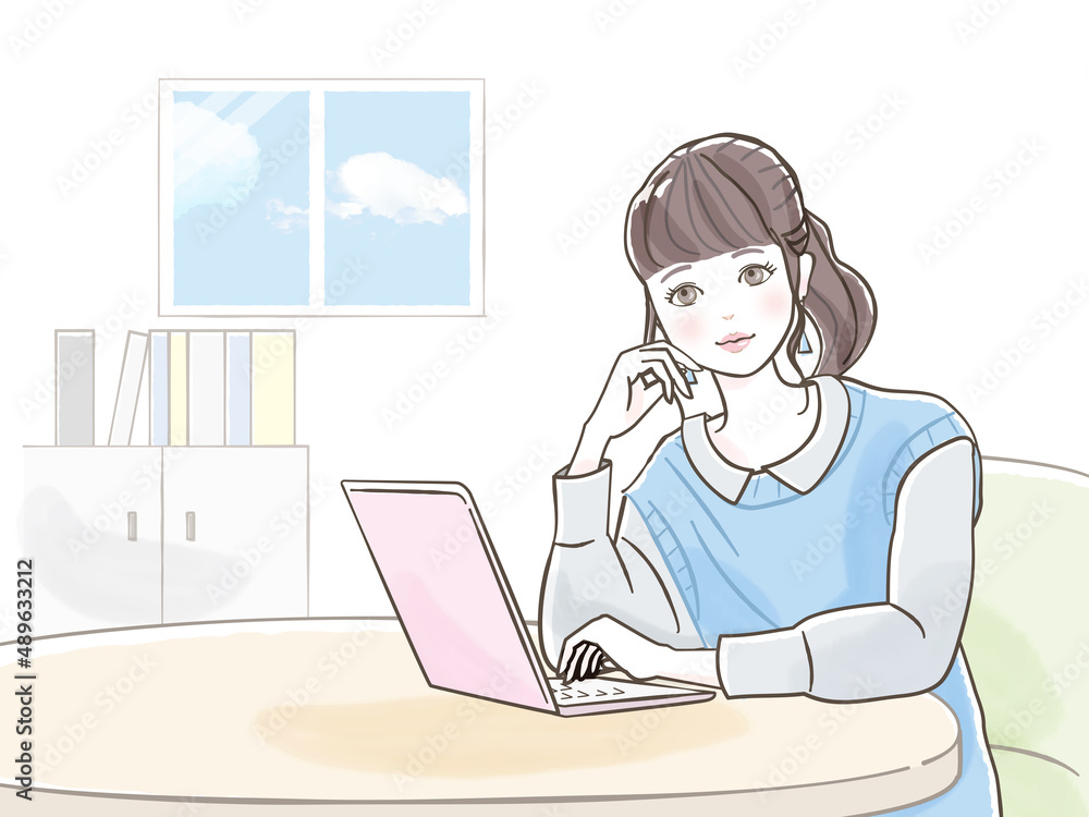 パソコンで仕事をしている若い女性